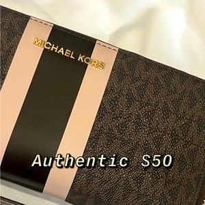 AUTHENTIC Michael Kors continental style wallet. Brown logo with pink stripes.